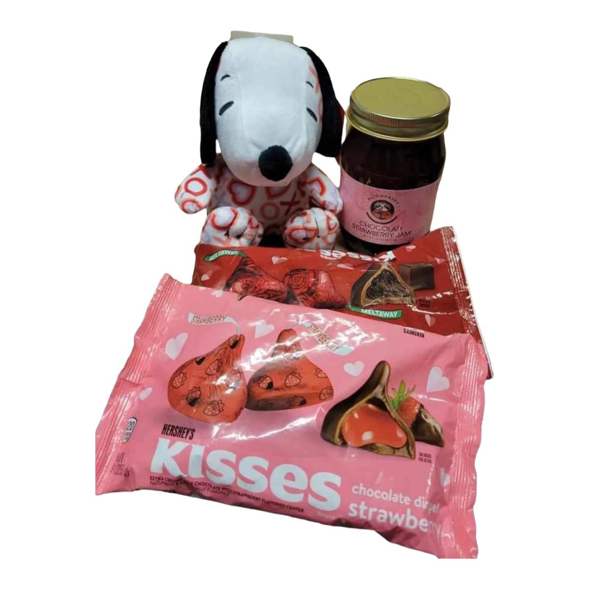 1 heart Snoopy plush, 1 9 oz bag of Hersheys chocolate dipped strawberry kisses, 1 9 oz bag of Hersheys milk chocolate meltway kisses, 1 18 oz jar F36825